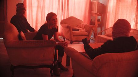 Johan Joseph translates for Mariana van Zeller while she interviews Pepper about his job as the gunman during cash-in-transity heists in Johannesburg, South Africa. (National Geographic)