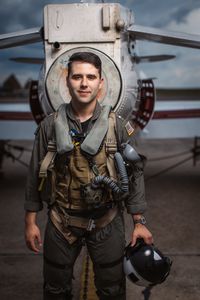 Student LTJG Marcus Figueroa poses behind a T-45. (Credit: National Geographic/Freddie Claire)