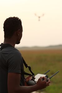 Behind-the-scenes as Anthony Njuguna operates the drone. (National Geographic/Joe Treddenick)