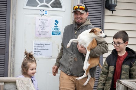 Hank leaves the clinic with his family after being treated for his muskrat attack injuries. (National Geographic/Grace Sabwira)