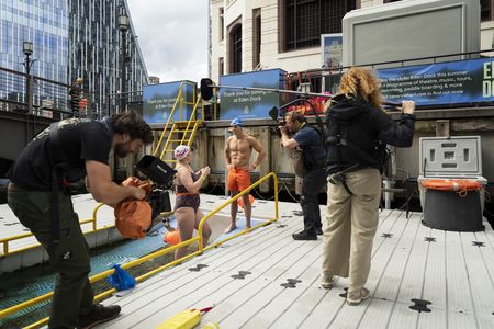 Behind-the-scenes as Antoni Porowski prepares to swim at Canary Wharf. (National Geographic/John Wendle)