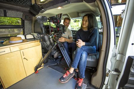 Chai Vasarhelyi prepares to interview Jimmy Chin as Clair Popkin frames up the shot. They are in Jimmy's van in Yosemite.  (National Geographic/Jimmy Chin)