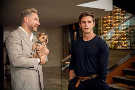 Kurt Macher, general manager of the Shangri La, with his dog Rocky, chats with Antoni in the foyer of the hotel. (National Geographic/Richard Ing)