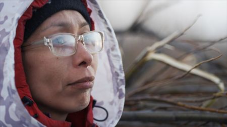 Louise Moses searching for passing waterfowl during the spring migratory hunting season. (National Geographic)