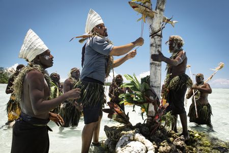 Will Smith takes part in an ancient ceremony that signifies an old reef area that is closed until the fish return.  (credit: National Geographic/Freddie Claire)