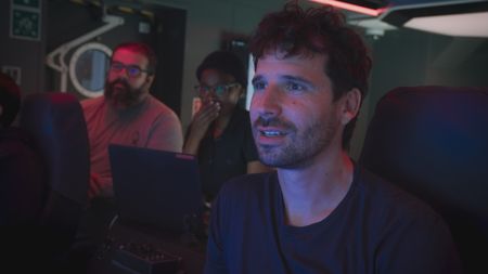 Carlos Fonseca is with Zoleka Filander and Eric Stackpole eagerly watching as the team attempts to tag a six gill shark from the submersible. (National Geographic)