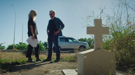 Mariana van Zeller and Miguel stand at a memorial in Culiacán, Mexico. (National Geographic)