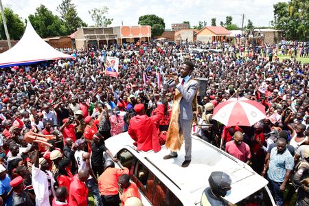 Robert Kyagulanyi Ssentamu (standing on roof of the vehicle), a candidate in Uganda's general elections in 2021 and widely regarded as the closest challenger to incumbent Yoweri Museveni, campaigns in Butaleja district in the country's East on November 17, 2020.  (photo credit: Lookman Kampala)