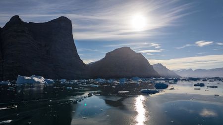 Boat below Ingmikortilaq.  (photo credit: National Geographic/Pablo Durana)