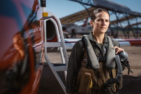Student Captain Steph Harris poses next to a T-45. (Credit: National Geographic/Freddie Claire)