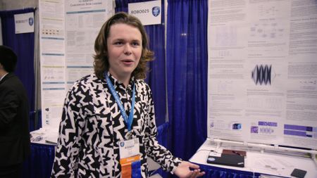 Robbie in front of ISEF board. (National Geographic)