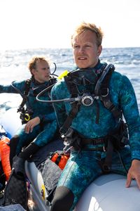 Underwater cameraman, Jeff Hester and host, Bertie Gregory looking out for the next dive site.  (credit: National Geographic/Adam Boyle)