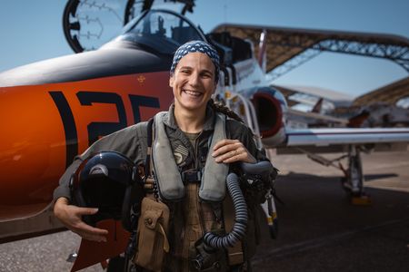 Student Captain Steph Harris poses next to a T-45. (Credit: National Geographic/Freddie Claire)