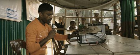Kamal Hussein works at the Lost and Found tent in the refugee camp. Using a microphone and broadcasting over a loudspeaker, Kamal has reunited hundreds of Rohingya refugees who have been torn apart by violence and chaos. Lost and Found, directed by Academy Award winner Orlando von Einsiedel (“The White Helmets”, “Virunga"), is an inspiring story of humanity and heroism in the world’s largest refugee camp, that follows Kamal Hussein, a Rohingya refugee, in his quest to reunite children with their parents. (Nobel Media/Franklin Dow)