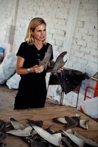 Mariana van Zeller holds dried shark fins. (National Geographic)