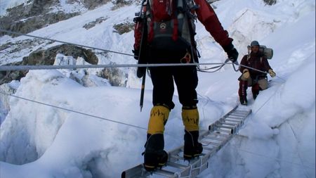 Jimmy Chin uses a ladder as a bridge to cross a cravasse in Mount Everest.  (credit: Jimmy Chin Productions)
