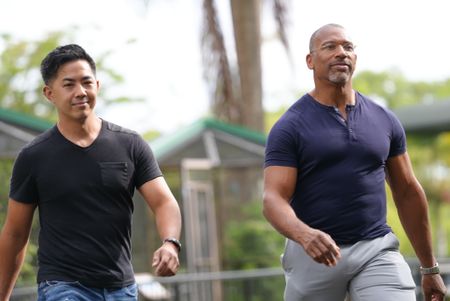 Zoo supervisor Kyle Arakaki and Christian Cooper walk to the ʻalalā enclosure at the Panaʻewa Rainforest Zoo. (National Geographic for Disney /Troy Christopher)