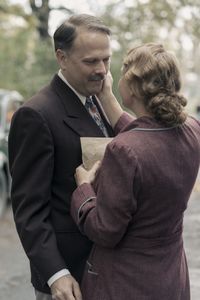 A SMALL LIGHT - Kugler, played by Nicholas Burns, says goodbye to his wife Laura, played by Sytske van der Ster, as seen in A SMALL LIGHT. (Credit: National Geographic for Disney/Dusan Martincek)