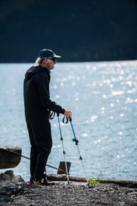 Sir Ranulph Fiennes stands by the beautiful aqua-green waters of Muncho Lake surrounded by an impressive backdrop of the foothills of the Rockies.  Amidst mountains and whale watching, Sir Ranulph Fiennes and his cousin Joseph Fiennes reflect on Ran’s epic life and his new challenge of life with Parkinson’s. (National Geographic)