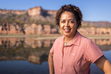 Paula Kahumbu visits the beautiful Gonarezhou National Park, one of the most remote parts of Zimbabwe. The Chilojo Cliffs can be seen in the background, which is why Paula has come. She is here to witness the local elephant herd scale down the cliffs in search of their next water supply in the dry season. (National Geographic for Disney/Freddie Claire)