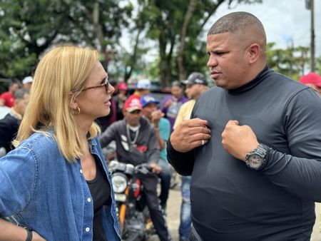 Mariana van Zeller talks to John near a group of bikers in Santiago. (Credit: National Geographic)