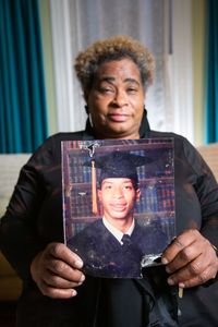 Marilyn Brown, sister of Fulton County John Doe David Brown, holds a graduation picture of her brother. (National Geographic/Tom Beard)