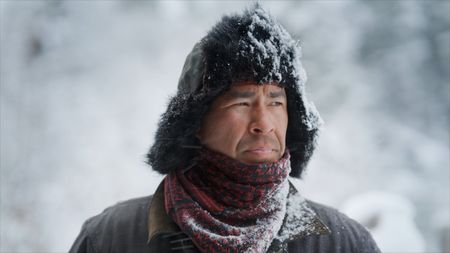 Joel Jacko battles the elements while retrieving his wood cutting machinery. (National Geographic)