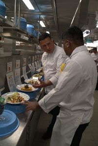 Chef Isai taste tests all the items on the Plaza de Coco menu and gives feedback to Chef de Cuisine Franky.  (credit: National Geographic/Matt Perez)