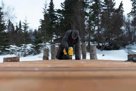 Joel Jacko builds a dock in the winter season. (National Geographic/Wayne Shockey)
