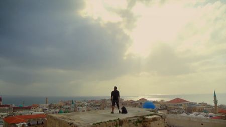 Acre, Israel - Albert Lin overlooking the city of Acre. (National Geographic)