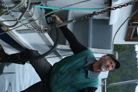 Jiggy Nichols refuels while commercially fishing for salmon. (National Geographic/Wayne Moss)