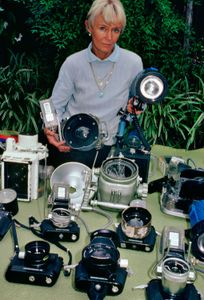 Valerie with a table full of camera equipment, in the late 1980s. (photo credit: Ron & Valerie Taylor)