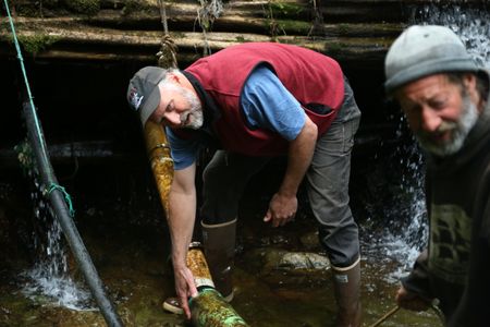 Jiggy Nichols and Dave Palmer rebuild a community damn. (National Geographic/Wayne Moss)