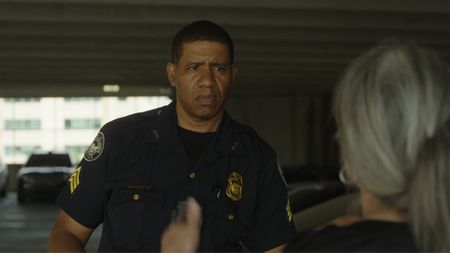 Sgt. Micheal Young, Atlanta Police Department, and DNA Doe Project volunteer Rebecca Somerhalder discuss their plan to door knock to find DNA relatives of Fulton County John Doe. (National Geographic/Tom Beard)