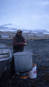 Marvin Agnot preparing crab he caught for his dinner. (National Geographic/Ashton Hurlburt)