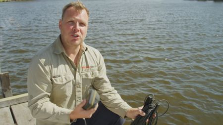 Dr. James Tweedley, expert, testing the salinity of the water at Swan River, AUS where Cameron Wrathall's shark attack occurred. (National Geographic)