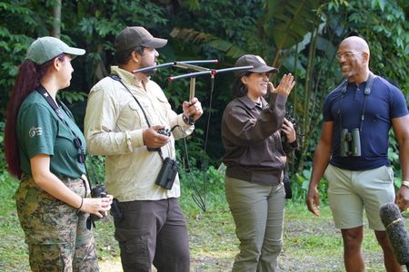 Christian Cooper observes the historic release of 7 Puerto Rican Parrots into the wild with Marisel López-Flores Lopez, the Project Leader of the Puerto Rican Parrot Recovery Program. (National Geographic for Disney)