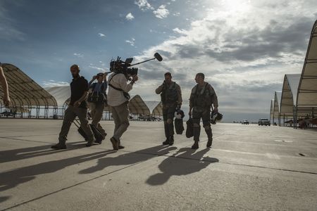 DOP Jon Southgate-Sayers films student LTJG Evan Morris and his instructor as they return from a flight. (National Geographic/Freddie Claire)