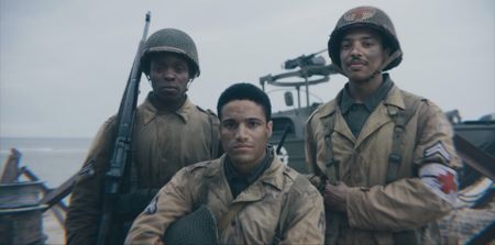 Private Henry Parham, Corporal William Dabney and Combat Medic Waverly Woodson (played by Ishmel Bridgeman, Joshua Riley, and Francesco Di Rauso) pose for a group portrait in a scene of a WW2 historic reenactment production for "Erased: WW2's Heroes of Color." (National Geographic)