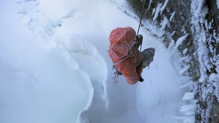 Will Gadd lowers himself after a carabiner malfunction almost caused him to fall.  (mandatory credit: Red Bull Media House)