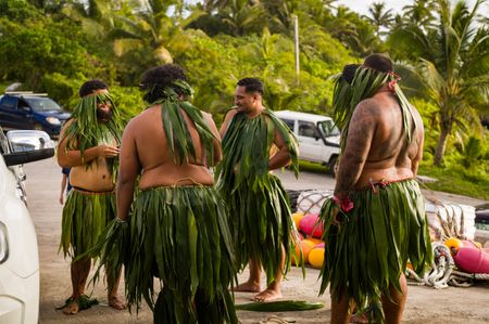 Takalo warriors await the arrival of the National Geographic Pristine Seas expedition team. National Geographic Pristine Seas explored the marine ecosystem in Niue -a small island nation in the tropical Pacific. Local and international scientists surveyed the ocean to understand its health and biodiversity. Thanks to local leadership, traditional knowledge, and strong science, the country has been able to protect large swaths of its marine environment. (National Geographic/Nova West)