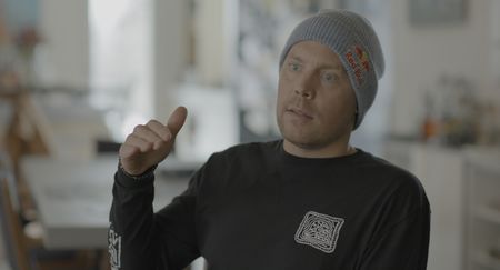 Big Mountain Snowboarder Travis Rice being interviewed by Jimmy Chin.   (photo credit: National Geographic/Ross McDonnell)
