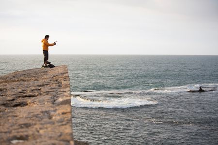 Acre, Israel - Dr. Albert Lin uses his iPad to visualize scanning data at the lagoon in Acre, Israel. (Blakeway Productions/National Geographic)