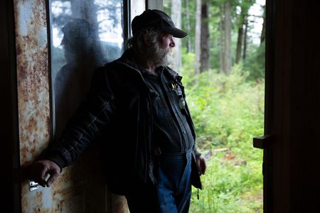 Terry Simpson is grateful for his neighbors' help in building him a new cabin. (National Geographic/Robert Jolley)