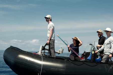 Rui Prieto, Melissa Marquez, Aldo Kane, and Crew Nick Olson riding on the Zodiac. (National Geographic/Mario Tadinac)