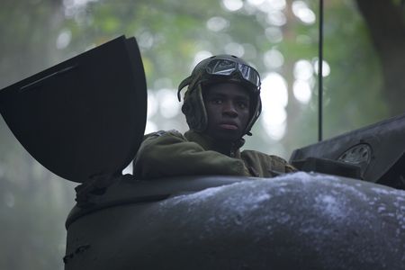 761st Black Panther Tank Battalion’s Tank Commander Johnnie Stevens (played by Juwon Adedokun) is pictured in a tank in a historic reenactment of the Battle of the Bulge produced for "Erased: WW2's Heroes of Color." Staff Sergeant Johnnie Stevens was a tank commander with the 761st Black Panther Tank Battalion who served in WW2. (National Geographic/Rekha Garton)
