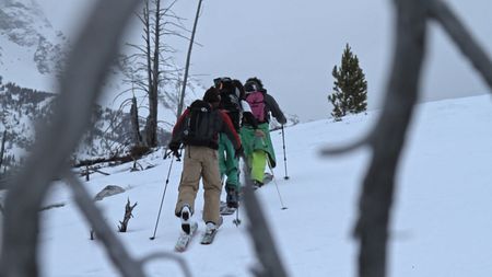 Jimmy Chin (left), Jeremy Jones (center), and Xavier de la Rue (right) walk up a mountain in the Teton range, Wyoming.  (credit: Teton Gravity Research)