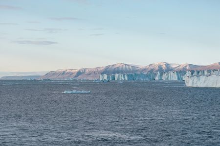 Mountains and a glacier on Svalbard, Norway. (National Geographic/Mario Tadinac)