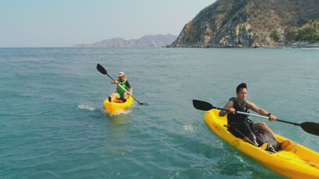 Albert Lin and Eduardo Mazuera kayaking along the coast of Santa Marta. (National Geographic)