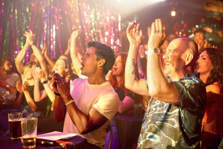 Antoni Porowski and John Sizzle cheer on drag performers at The Divine. (National Geographic/Richard Ing)